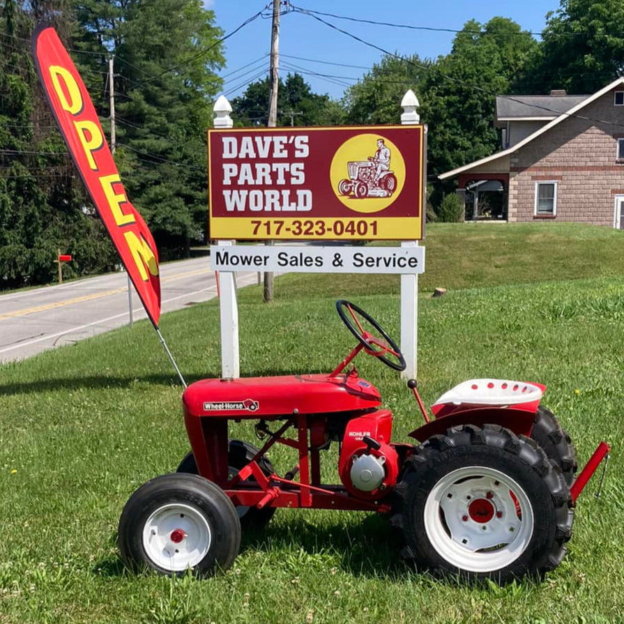 Dave's Parts World Sign and Wheel Horse Tractor